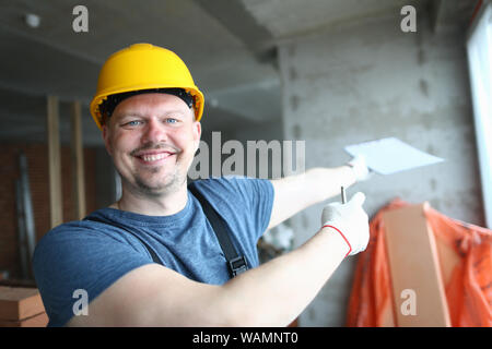 Cheerful builder looking at camera Stock Photo