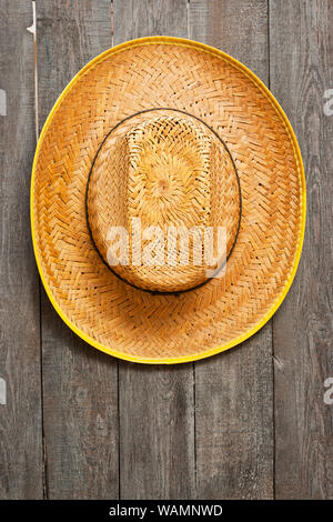 old straw hat isolated on white background Stock Photo - Alamy