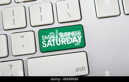 Text of Small Business Saturday on computer keyboard, American shopping holiday Stock Photo