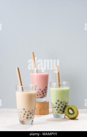 Various Bubble Tea glasses with drink straws isolated on white background. Stock Photo
