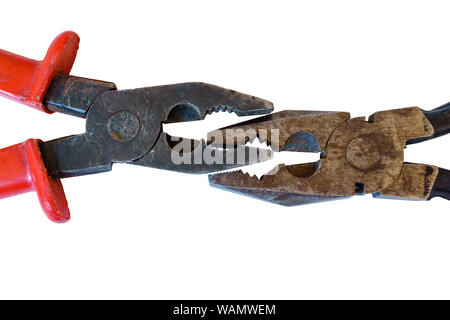 two used rusty worn pliers biting each other on a white background Stock Photo