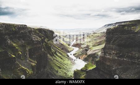 Beautiful wide shot of one of many big cracks in nature out in the Icelandic countryside Stock Photo