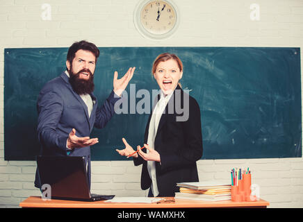 Time to chill. paper work. office life. teacher and student on exam. back to school. Non-formal education. business couple use laptop and document. businessman and secretary. Enjoying time in college. Stock Photo