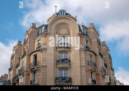 A Typical parisian building facade with its windows and balcony Stock Photo