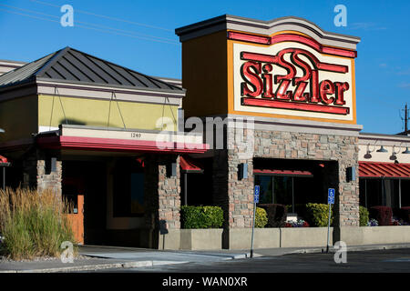 A logo sign outside of a Sizzler restaurant location in Orem, Utah on July 29, 2019. Stock Photo