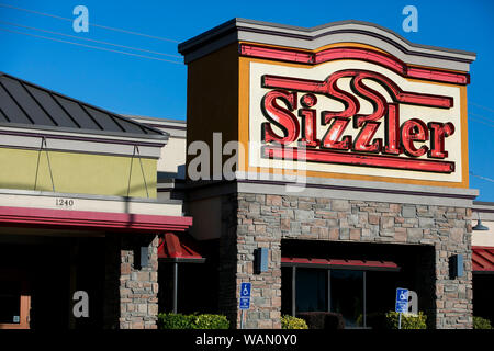 A logo sign outside of a Sizzler restaurant location in Orem, Utah on July 29, 2019. Stock Photo