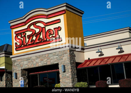 A logo sign outside of a Sizzler restaurant location in Orem, Utah on July 29, 2019. Stock Photo