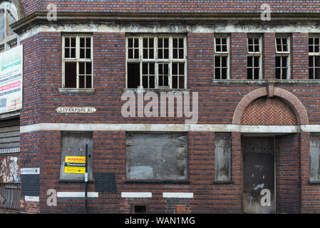 Old victorian factory building with boarded-up windows in Digbeth, Birmingham, UK Stock Photo
