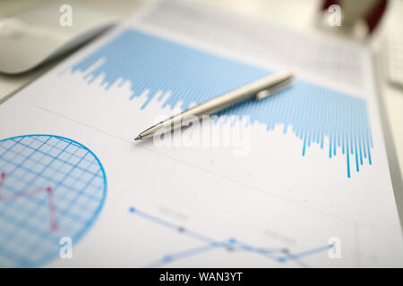 Silver pen lies on paper documents with color Stock Photo