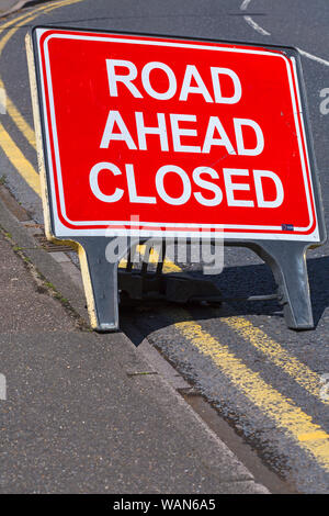 Road ahead closed sign on road with double yellow lines at Westbourne, Bournemouth, Dorset UK in August Stock Photo