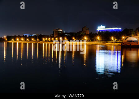 Russia, Irkutsk - July 19, 2019: Colorfull reflection in Angara river of night photo near embankment, Irkutsk Stock Photo