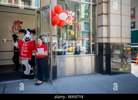 Chick-Fil-A fast food restaurant celebrates the opeing of a new store in the Chelsea neighborhood of New York on Saturday, August 10, 2019. ACSI, a customer data evaluation company, released the results of their evaluations and announced that customers rank Chick-Fil-A the best fast food restaurant in the U.S. for customer satisfaction.  (© Richard B. Levine) Stock Photo