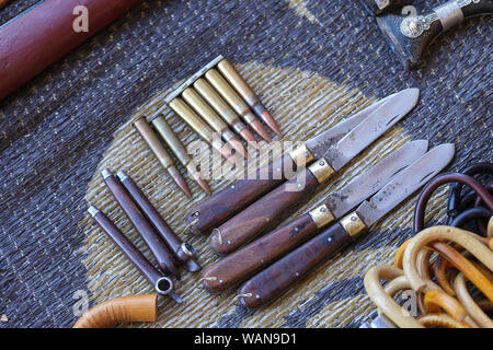 Knives, sticks and bullets on display for selling at Sinaw market, Oman Stock Photo