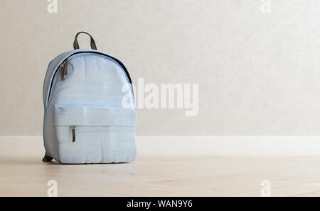 Realistic baby blue backpack on the wooden floor and light beige wall in the background, close up, mock-up, poster, 3d rendering Stock Photo