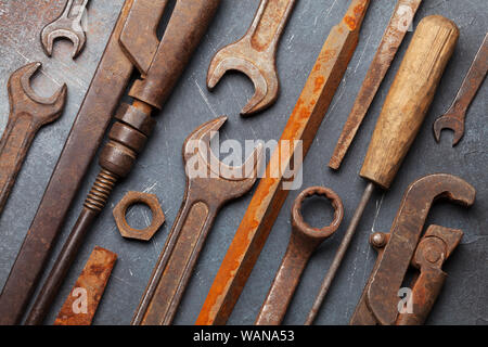 Vintage old tools on stone backdrop. Top view closeup. Flat lay Stock Photo