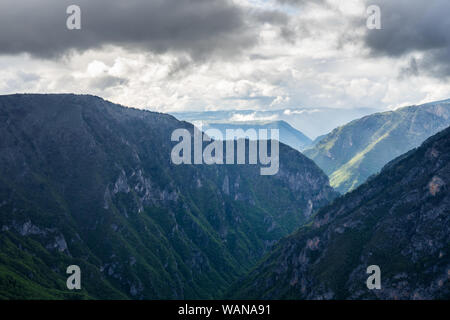 Montenegro, Beautiful dramatic sky over giant tara river canyon nature landscape from above in magical sunset light after heavy rain in durmitor natio Stock Photo