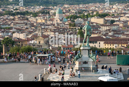 Florence, Italy - 2019, August 16: David statue at Piazzale Michelangelo.Tourists and visitors crowd the square in a summer day.