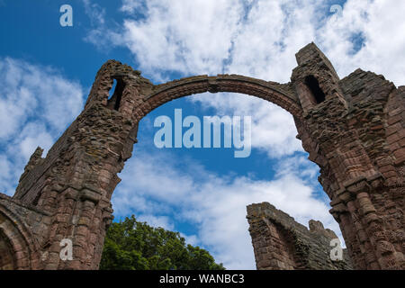 The ruins of Lindisfarne Priory on The Holy Island of Lindisfarne in Northumberland, UK Stock Photo