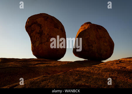 Well balanced granite boulders called Devils Marbles. Stock Photo