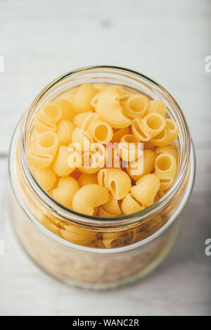 Jar of Italian whole wheat pipe rigate pasta Stock Photo