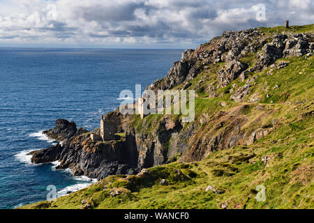 Engine houses at Crown Mines on seaside cliff of Botallack tin and copper mine Cornwall England Stock Photo