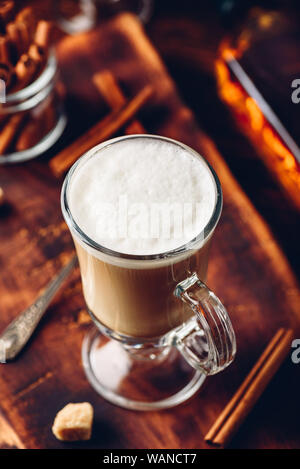 Irish coffee with cinnamon on wooden surface Stock Photo