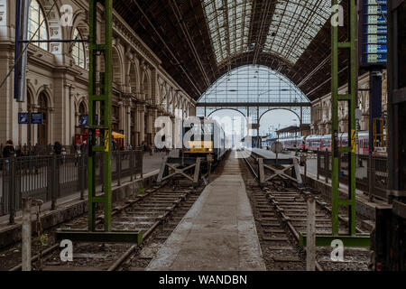 Train waiting for departure inside the Keleti railway station in Budapest. Stock Photo