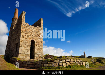 West Wheal Owles Pump house ruins with chimney and moon at Cargodna Mine Botallack Cornwall England Stock Photo