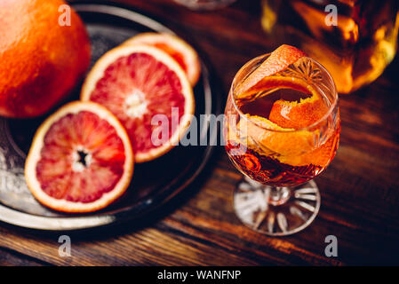 Whiskey sour cocktail with aged bourbon, blood orange juice and cherry syrup Stock Photo