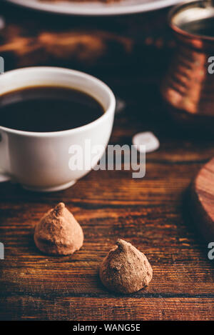 Homemade chocolate truffles coated with black coffee Stock Photo