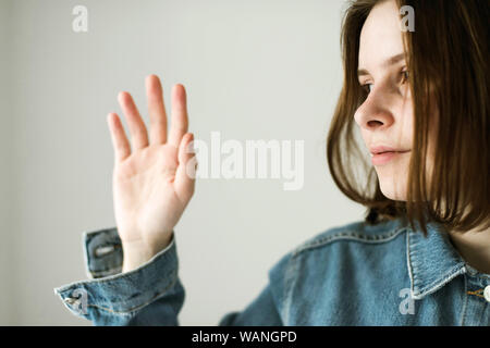 Attractive woman standing and looking up. Side view. Isolated on white  Stock Photo - Alamy