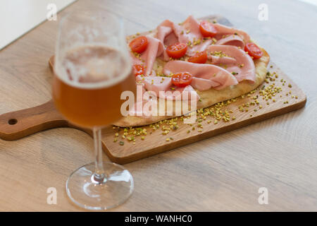 Italian happy hour food detail with pizza and beer glass Stock Photo