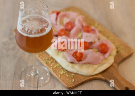 Italian happy hour food detail with pizza and beer glass Stock Photo