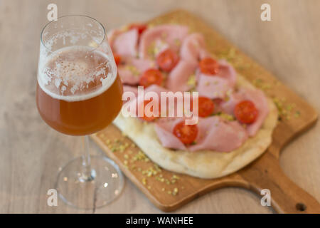 Italian happy hour food detail with pizza and beer glass Stock Photo