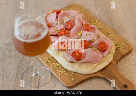 Italian happy hour food detail with pizza and beer glass Stock Photo