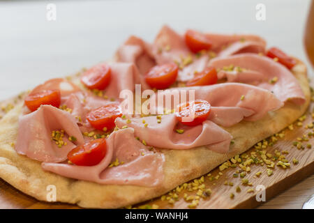 Italian happy hour food detail with pizza and beer glass Stock Photo