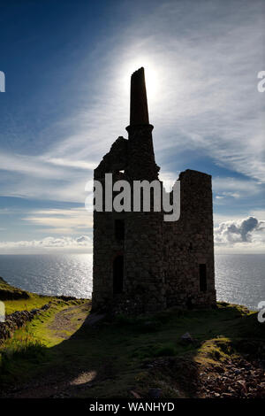 Silhouette of West Wheal Owles tin mine engine house ruins of Cargodna Mine in Botallack Cornwall England on the Atlantic Ocean Stock Photo