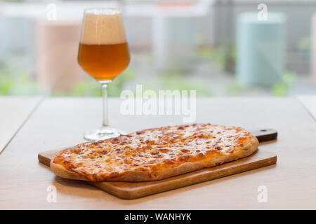 Italian happy hour food detail with pizza and beer glass Stock Photo