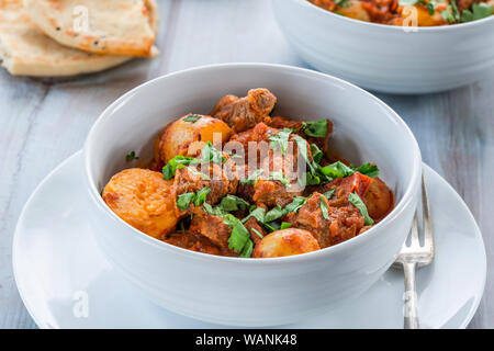 Aloo gosht with naan bread - lamb and potato curry - cuisine popular in Pakistan, Bangladesh and North India Stock Photo