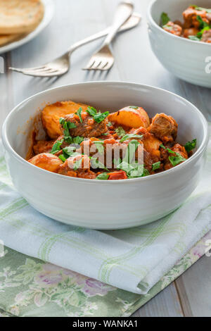 Aloo gosht with naan bread - lamb and potato curry - cuisine popular in Pakistan, Bangladesh and North India Stock Photo