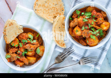 Aloo gosht with naan bread - lamb and potato curry - cuisine popular in Pakistan, Bangladesh and North India Stock Photo