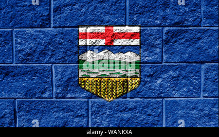 Flag of Alberta close up painted on a cracked wall Stock Photo