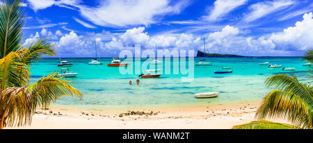 Beautiful Cap Malheureux,view with turquoise sea,palm trees and yachts,Mauritius island. Stock Photo