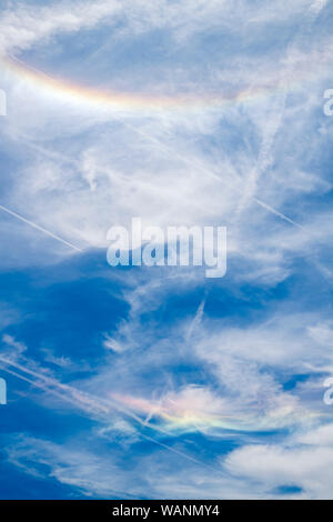 Circumzenithal arc against blue sky with white clouds seen in south of France near Marseille during summer 2019 (31st July 2019) Stock Photo