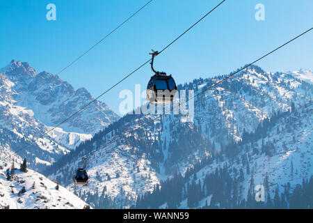 Almaty, Kazakhstan ski lift, gondola cable car at Medeo to Shymbulak against mountain background Stock Photo