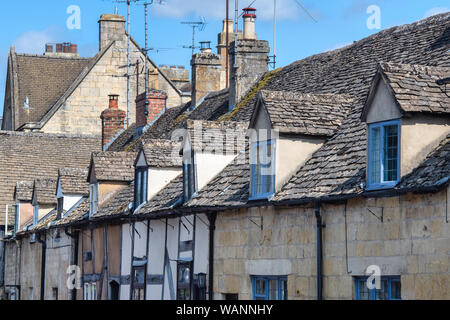 Dormer windows on cotswold stone buildings along Gloucester Street, Winchcombe, Gloucestershire, England Stock Photo