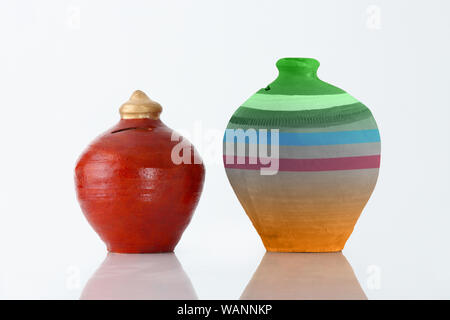 Comparison between two piggy banks Stock Photo