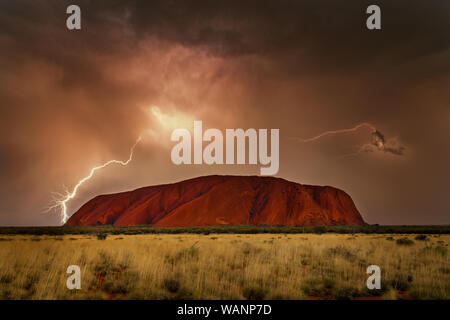 Very rarely to see famous Uluru in a thunderstorm. Stock Photo
