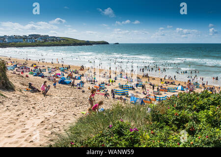 Holidaymakers on a sunny Fistral Beach in Newquay in Cornwall. Stock Photo