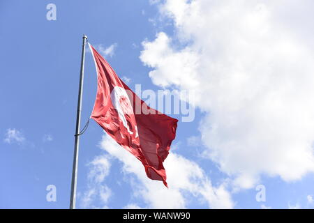 Turkish flag waving in sky Stock Photo